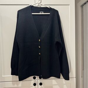 Elegant Black Sweater with Gold Accents